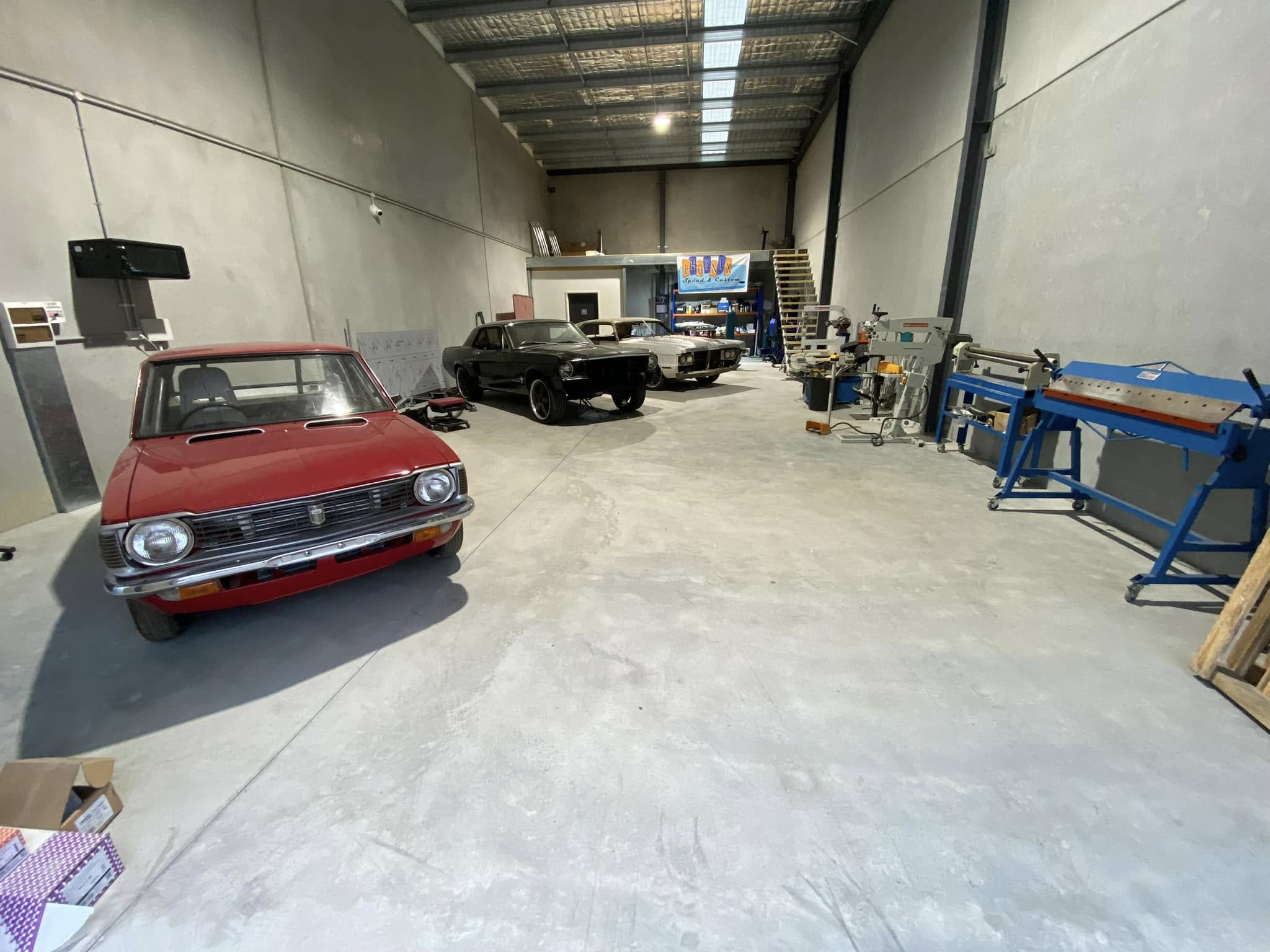 Phoenix Speed & Custom workshop with classic cars and fabrication equipment